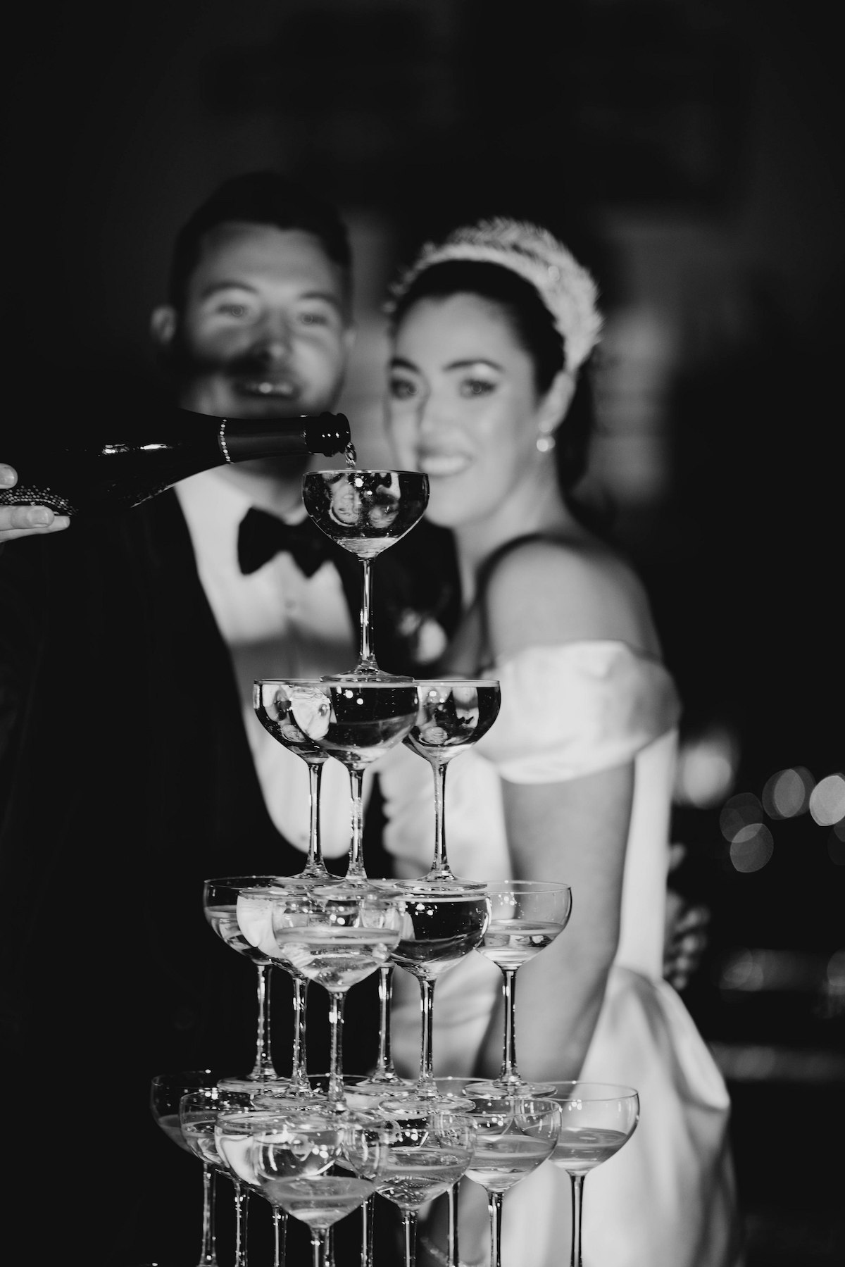 champagne tower bride and groom